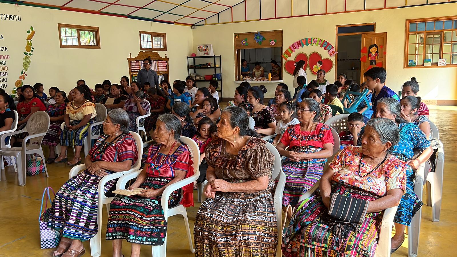 women listening to speaker aleluya