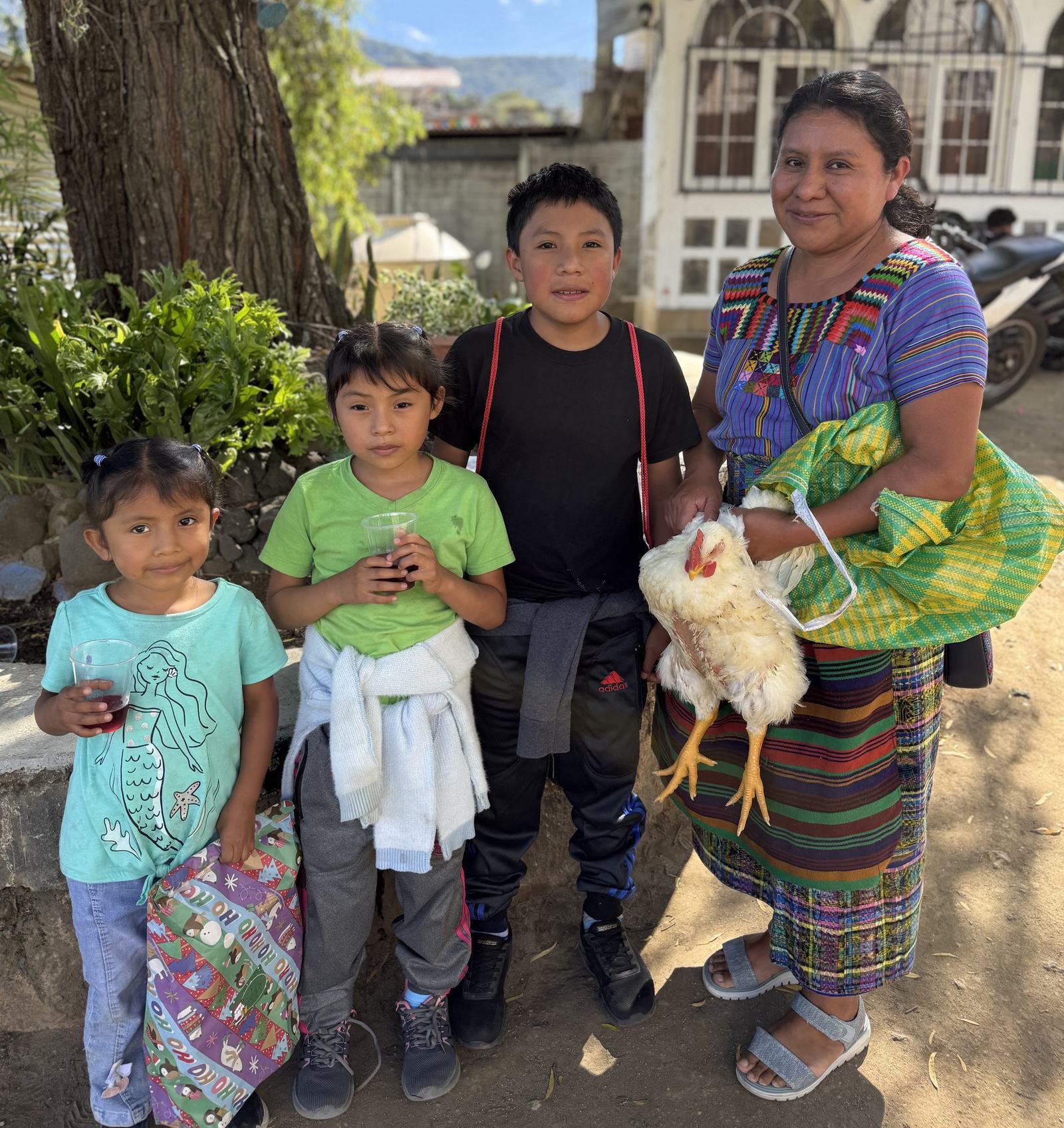 August 2026 family with chicken and gifts aleluya